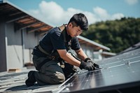 Engineer fixing solar panel adult roof transportation. AI generated Image by rawpixel.