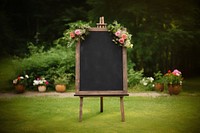 Blackboard wedding sign flower plant grass. 