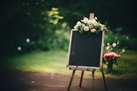 Blackboard wedding sign flower plant celebration. 