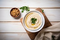 Hummus table plate food. AI generated Image by rawpixel.