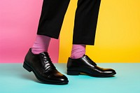 Black leather shoes footwear sock pantyhose. 