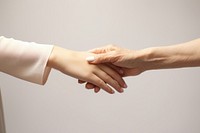 Woman hand handshake togetherness copy space. 