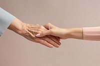 Women holding old woman hand togetherness handshake agreement. 