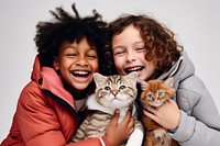 Kids hugging a cat photography laughing portrait. 