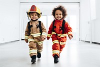 Kids wearing firefighter costume helmet child fun. 