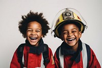 Kids wearing firefighter costume laughing smile fun. 