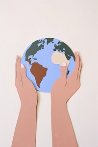 Hands holding a paper earth planet globe space. 