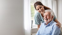 Caring female doctor embracing helping happy senior male disabled patient smiling adult care. 