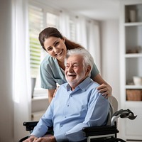 Caring female doctor embracing helping happy senior male disabled patient medical smiling adult. 