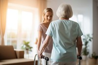 Young caregiver helping senior woman walking nurse patient adult. 