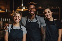 3 black baristas smiling adult togetherness. 