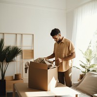 Mixed race man box cardboard carton. 