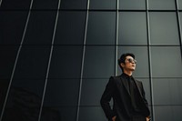 Photo of asian men look up the same way, wear suit and sunglasses. AI generated Image by rawpixel. 