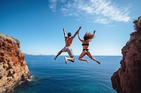 Jumping a cliff diving outdoors nature. AI generated Image by rawpixel.