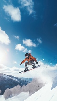 a photo of the man jumping with snowboard from the hill.  