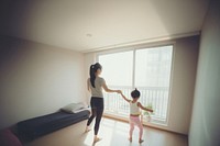 Young asian woman furniture child adult. AI generated Image by rawpixel.