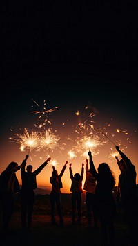 People celebrating New Year fireworks outdoors light. 