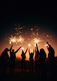 People celebrating New Year fireworks outdoors light. 