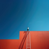 Photography of a man climbing a ladder to the roof.  