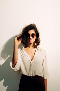 Woman hand holding sunglasses portrait blouse sleeve. AI generated Image by rawpixel.