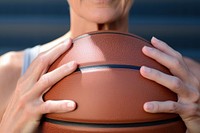 Woman holding basketball sports exercising midsection. 