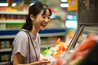 Supermarket groceries smiling adult. 