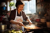 Aunt cooking food adult concentration. 