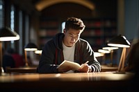 University student reading book publication. 