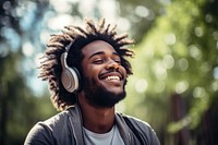 Happy man headphones listening outdoors. 