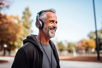 Happy positive mature man headphones headset adult. 