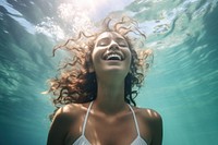 Swimming tropical ocean underwater laughing. 