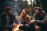 Camping laughing campfire bonding. 