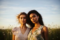 Two women portrait nature flower. 