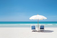 Lounge chairs beach sea umbrella. 