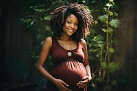 Pregnant black woman smiling holding smile. AI generated Image by rawpixel.