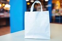 Blue shopping bag handbag white consumerism. 