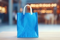 Blue shopping bag handbag illuminated consumerism. 