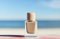 Nail polish bottle cosmetics perfume beach. 