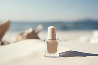 Nail polish bottle cosmetics perfume beach. 