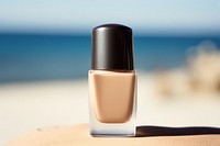 Nail polish bottle cosmetics beach day.