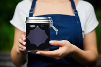 Blackberry jam jar holding black. 