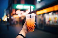 Bubble tea cup holding drink soda. 