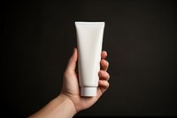 Day cream lotion cosmetics holding hand. 