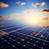 Photo of solar panels arrayed in a vast field.  