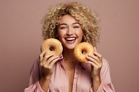 Woman showing donuts portrait smile adult. 