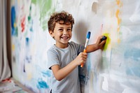 Brush painting child wall. 