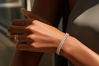 Diamond bracelet jewelry ring hand. AI generated Image by rawpixel.