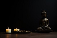 Buddhist statue candle spirituality cross-legged. AI generated Image by rawpixel.