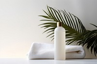 White cosmetic bottles towel white container.