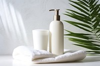 White cosmetic bottles cosmetics towel white. 